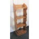 A narrow oak open ookcase of three shelves on plinth base, 32cm