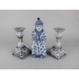 A pair of French Rouen faience candlesticks square form decorated with scrolls, 16.5cm anda blue and