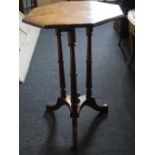 A Victorian mahogany octagonal occasional table on three column support and tripod base, 50cm