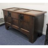 An 18th century oak coffer with three panel top and sides, two meat locks (no keys) on bracket