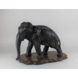 A Japanese Meiji period bronze model of an elephant, character seal mark to the underside of foot,
