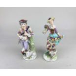 A pair of porcelain gold anchor figures of a musician and a flower seller, (a/f) 17cm