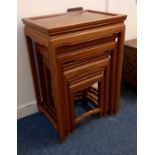 A nest of four Chinese hardwood occasional tables with rectangular dished tops, 48cm