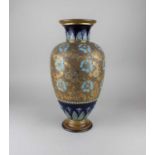 A Royal Doulton glazed stoneware baluster vase with impressed floral decoration and gilt