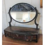 A George III oval dressing table mirror on bowfront box base with three drawers (a/f) 52cm