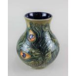 A Moorcroft pottery peacock feather baluster vase 16cm high, with box