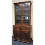 A Victorian glazed bookcase top section with two panel gazed doors enclosing three shelves on base
