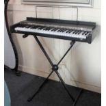 A Hohner Pianet T electric piano with Proel metal stand