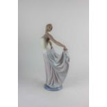 A Lladro porcelain figure of a dancer holding her skirts 31cm high