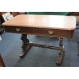 A Victorian mahogany library table the rectangular top with rounded corners above two drawers on