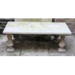 A rectangular stone compostion garden bench on four baluster supports, 109cm