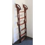 A metal mounted mahogany boarding ladder 142cm fully extended