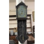 A 19th century Dutch wall clock, the carved case with glazed hood enclosing a painted dial with