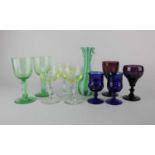 A Murano latticino glass vase with green stripes 16.5cm high, three uranium wine glasses, two