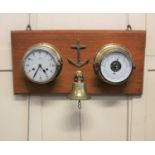 A Schatz Royal Mariner brass cased bulkhead wall clock and a Schatz open dial aneroid barometer,