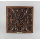 A carved oak panel bearing an engraved plaque 'Oak panel from the foreign secretary's office