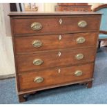 A George III small mahogany chest of four drawers with brass oval handles with sphinx and pyramid