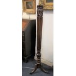 A mahogany fluted column standard lamp on tripod base height 138cm