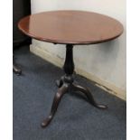 A 19th century mahogany circular tea table with birdcage support and blauster support tripod base