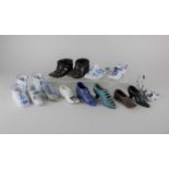 A collection of novelty shoe ornaments to include eleven porcelain shoes, a metal shoe and a pair of