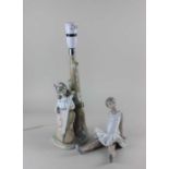 A Lladro porcelain figural table lamp in the form of a young girl playing a cello beside a tree 38cm