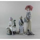 A Lladro porcelain figure of a woman with a parasol 37cm another of a seated woman holding lilies, a