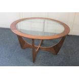 A G-plan style coffee circular coffee table with glass top, 84cm