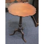 A George III mahogany tripod wine table circular top with scalloped edge, 45cm