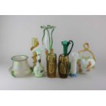 A collection of coloured glass vases to include a tall clear glass vase with frilled rim and