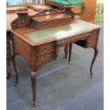 A Victorian writing desk with raised back and stationary box, green leather inset top and side
