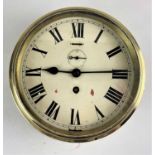 A brass cased bulkhead clock with Roman numerals, dial 7 1/4 inches, no key (a/f)