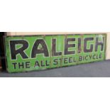 A Raleigh painted metal advertising sign Raleigh The All-Steel Bicycle in black and white edged