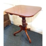 A 19th century mahogany rectangular occasional table with tilting top on turned pedestal stem and