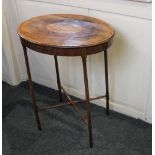 An Edwardian mahogany inlaid occasional table, the crossbanded oval top with central shell motif, on