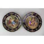 A pair of Sevres Chateau des Tuileries porcelain cabinet plates, verso printed marks, decorated with