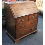 A George III oak bureau with fall front above two short over two long drawers, on bracket feet, 81cm