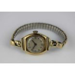 A ladies 18ct gold cased wristwatch the circular jewelled movement detailed 'S&Co Swiss', the