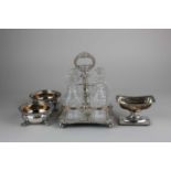 A silver plated four glass cruet set with central loop handle 13cm, a pair of cauldron shaped salt