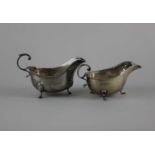 A George V silver sauce boat with gadrooned border and flying scroll handle, maker John Collard