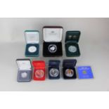 A collection of eight cased silver proof commemorative coins including a Perth Mint Sydney