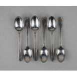 A cased set of six George V silver golf trophy spoons with cross golf club and ball terminals, maker