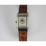 A Jaeger-Le Coultre Reverso steel cased day and night rectangular cased wristwatch the day dial with