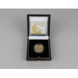 A Royal Mint 2007 Britannia Quarter-Ounce £25 gold proof coin in plastic capsule and box with