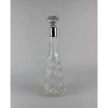 A George V silver mounted cut glass tall decanter 33.5cm tall, with a matched stopper (does not