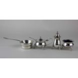 A modern silver three piece cruet set comprising of mustard pot and spoon, salt and pepper pot,