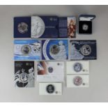 Eight Royal Mint Britannia silver two pound coins in card packages, a cased one pound coin and a