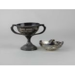 A George V silver trophy cup with inscription, Chester 1928 and a small silver pierced bonbon