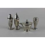 A George V silver three piece cruet set facetted baluster form including mustard with blue glass