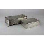 A George VI silver cigarette box with rectangular engine turned engraved lid, fitted interior and