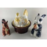 A Portuguese ceramic chicken on a basket, together with two Tony Wood novelty teapots in the form of